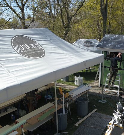Overhead view of DeBlois Renovation and Remodeling using heavy duty Mastertent canopy tent for operations. 